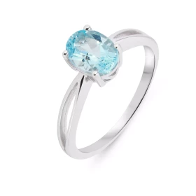 Bague Élancée Argent Topaze bleue traitée Ovale 8x6mm Bague argent mettant valeur une pierre ovale 8x6 mm, sertie par 4 gr...