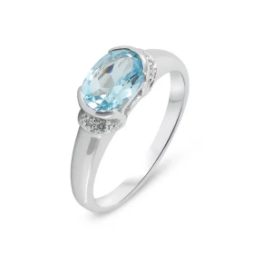  Bague Or Blanc 375 Topaze Bleue Traitée Diamant Cette jolie monture forme jonc est sertie d une Topaze ovale La pierre me...