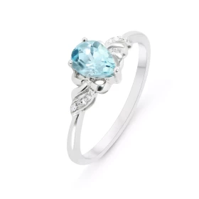 Bague Or Blanc 375 Topaze bleue traitée Poire 7x5mm Diamants Bague sertie d une Topaze bleue traitée poire 7x5mm 4 diamant...
