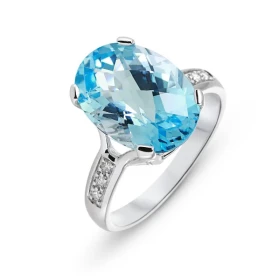  Bague Or Blanc 750 Topaze Bleue 14x10mm Diamant Pierre ovale 14x10mm (7.2 carats) Entourage composé 6 diamants 1.4mm Poid...