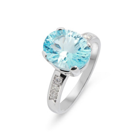 Bague Or Blanc 750 sertie d une Topaze Bleue traitée Ovale 11x9mm 6 diamants 1.7mm Poids Topaze : 4.2 carats Poids Diaman...