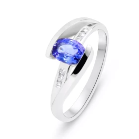  Bague Or Blanc sertie d une Tanzanite ovale 7x5mm (1 carat) 6 diamants 1,3mm diamètre pour un poids total 0,065carat Larg...