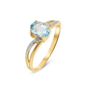  Bague Or jaune 375 Topaze Bleue Ovale 7x5mm Diamant Cette bague Or jaune 375 est ornée d une topaze bleue ovale La pierre...