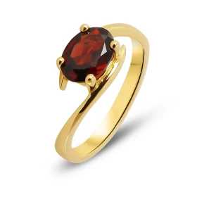  Bague or jaune 750 sertie d un grenat ovale 8x6mm Corps croisé Serti à griffes Poids grenat : 1,4 carat 