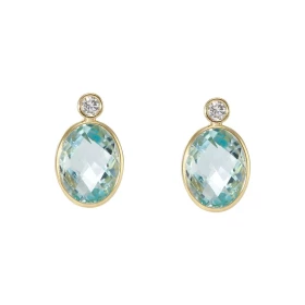 Puces d oreilles Or Jaune 750 Topaze bleue traitée Ovale Oxydes zirconium Chaque boucle est sertie d une pierre ovale 9x7m...