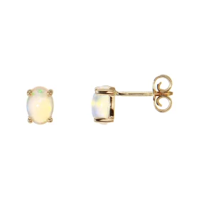  Boucles d oreilles Or Jaune 750 serties 2 opales ovales 7x5mm Poids total opale : 1 carat Serti à griffes Système fermetu...
