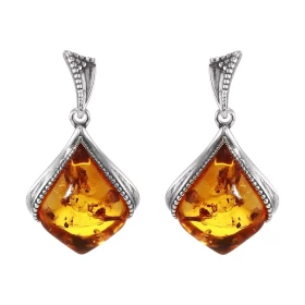 Boucles d oreilles pendantes argent composées d une ambre 11x14mm Ambre couleur cognac Système d attache : poussette belge...