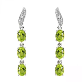 Boucles d oreilles Or blanc 375 serties 6 péridots ovales 4x3mm 2 diamants Longueur : 25mm Poids Diamant : 0,01 carats Qua...