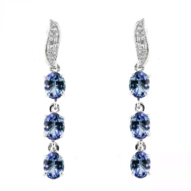 Boucles d oreilles Or blanc 375 serties 6 tanzanites ovales 4x3mm 2 diamants Longueur : 25mm Poids Diamant : 0,01 carats Q...