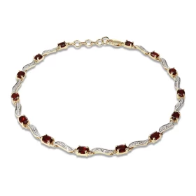 Bracelet Or Jaune 375 2 tons Grenats Ce bracelet est serti 14 grenats ovales 4x3mm espacés par des motifs ondulés Longueur...
