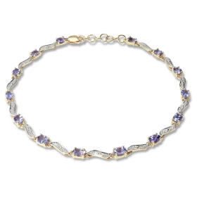 Bracelet Or Jaune 375 2 tons Tanzanites Ce bracelet est serti 14 tanzanites ovales 4x3mm espacées par des motifs ondulés L...