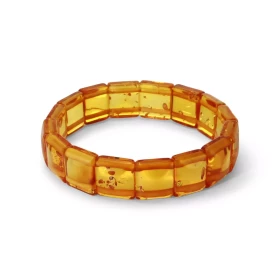 Bracelet Plaquettes Ambre couleur miel 12.8mm x 17.6cm Ambre couleur miel Enfilage sur élastique double Largeur : 12.8mm L...