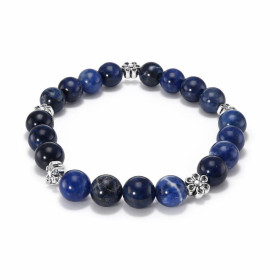 Bracelet Sodalite 8mm fleur métal Ce Bracelet est composé perles 8mm Sodalite 5 intercalaires métal représentant une fleur...