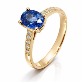  Bague Or Jaune 750 sertie d un Saphir Ceylan ovale 7.5x5.5mm Entourage composé 10 diamants 1,2mm 