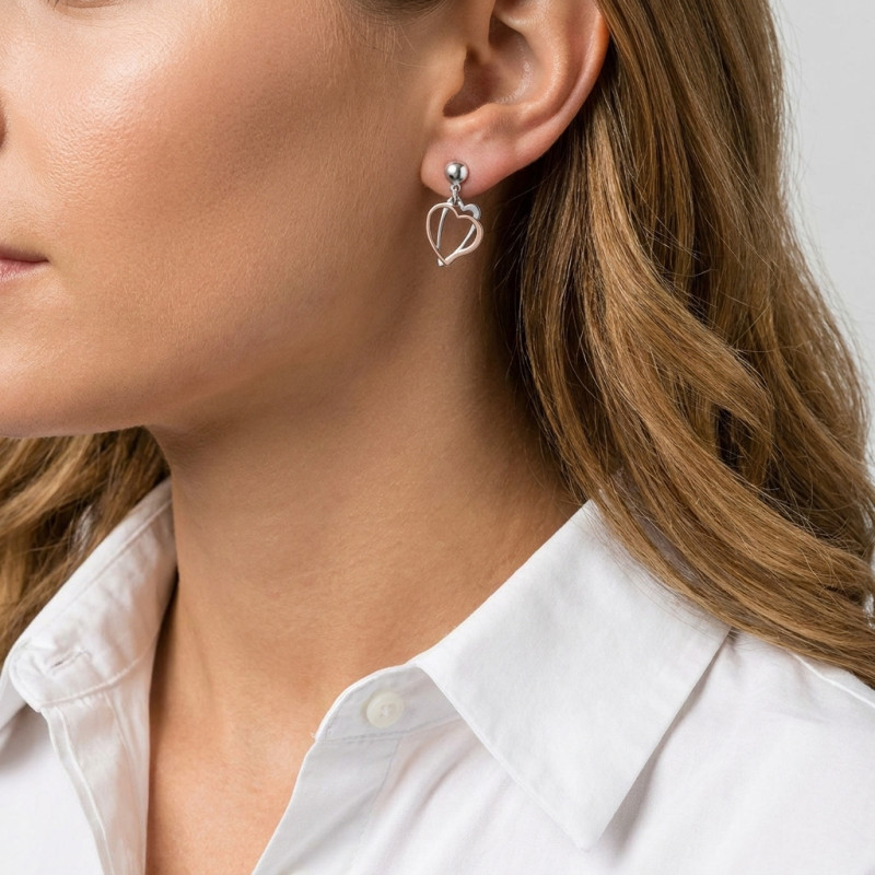 Boucles d'oreilles pendantes argent rhodié coeurs 2 tons porté
