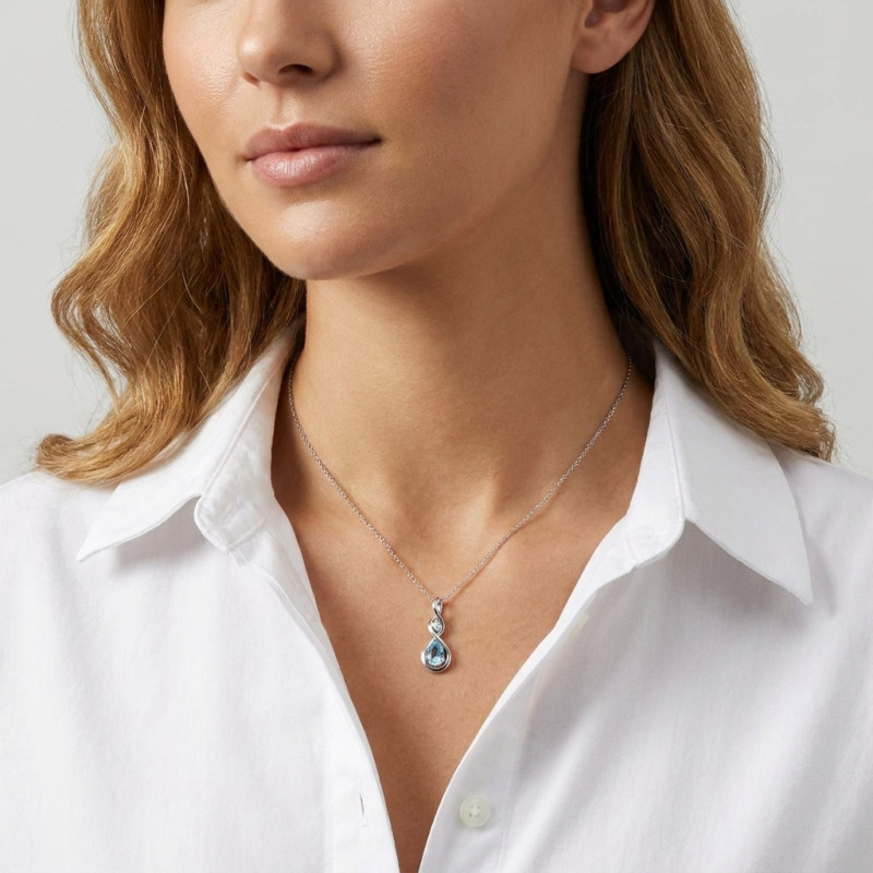 Pendentif Argent 925 Rhodié Signe Infini Topaze bleue traitée poire et Oxyde de Zirconium porté