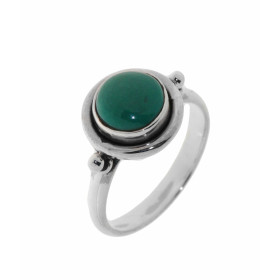 Bague Argent 925 et Turquoise reconstituée . Cette bague est sertie d'une pierre ronde. La pierre est taillée à cabochon e...