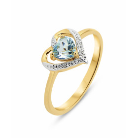 Bague Coeur Or jaune 375 Topaze Bleue et Diamant. Monture en forme de coeur en Or 375 (Or 9 carats). Pierre centrale taill...