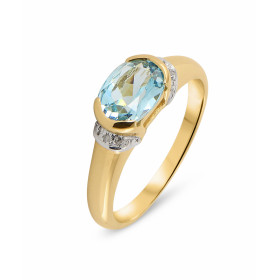 Bague Or Jaune 375 Topaze Bleue Traitée et Diamant. Cette jolie monture en forme de jonc est sertie d'une Topaze ovale. La...