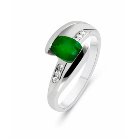  Bague Or Blanc sertie d une émeraude ovale 7x5mm et 6 diamants 1,3mm diamètre largeur monture (vue dessus) : 8,9mm Poids ...