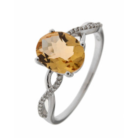 Bague Or Blanc 375 Citrine Ovale 8x6mm et Diamant. Bague en Or Blanc 375. Citrine Ovale taille dôme de 8x6mm sertie à grif...