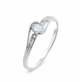 Bague Topaze Bleue Traitée Diamant Or Blanc 375 La pierre centrale est une Topaze Bleue ovale mesurant 5x3mm Elle est main...