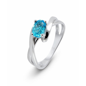 Bague Or Blanc 375 Topaze bleue traitée Ovale 7x5mm Bague Or Blanc 375 sertie d une pierre ovale 7X5mm Monture composée de...