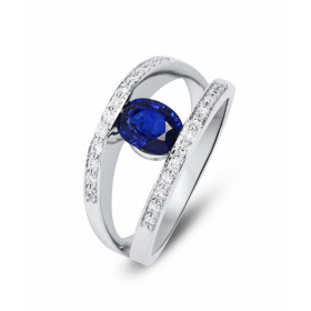 Bague or blanc 750 sertie d un saphir ovale .7x5mm (poids : 1 carat) 24 diamants 1,1 mm entourage (poids total 0,14 carat ...