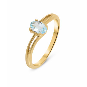 Bague en Or Jaune 375 et Topaze Bleue Traitée. Cette jolie bague avec corps ondulé est ornée d'une pierre ovale. La pierre...