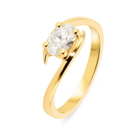 Bague Or Jaune 750 Diamant Ovale 7x5mm. Diamant ovale de 0.60 carat - Couleur J - Pureté Si2. Serti à 4 griffes. Corps croisé