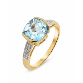 Bague Topaze Bleue Traitée et Diamant en Or Jaune 375. Cette bague en Or 375 est sertie d'une Topaze taille coussin. La pi...