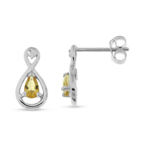 Boucles d'oreilles en Or blanc 375 serties de citrines poires de 5x3mm et de 2 diamants. Dimensions du motif (vue de face)...