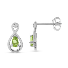 Boucles d oreilles Or blanc 375 serties péridots poires 5x3mm 2 diamants Dimensions du motif (vue face) : 13x7mm Poids Dia...