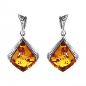 Boucles d oreilles pendantes argent composées d une ambre 11x14mm Ambre couleur cognac Système d attache : poussette belge...