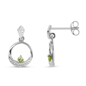 Boucles d'oreilles Pendantes Or blanc 375 et Péridot. Boucles d'oreilles en Or blanc 375 (9 carats). Motif rond serti d'un...