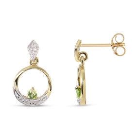 Boucles d'oreilles Pendantes Or jaune 375 et Péridot. Boucles d'oreilles en Or jaune 375 (9 carats). Motif rond serti d'un...