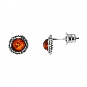 Boucles d'oreilles puces en argent composées d'une ambre de couleur cognac de 5mm de diamètre et un entourage torsadé en a...