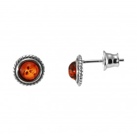 Boucles d oreilles puces argent composées d une ambre couleur cognac 5mm diamètre un entourage torsadé argent Système d at...