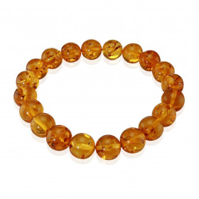 Bracelet en ambre sur un fil élastique. Ambre de couleur cognac. Dimension des perles : 10mm. Longueur : 18cm