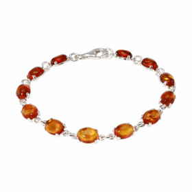 Bracelet en Argent 925 et Ambre couleur cognac. Pierres de forme ovale. Dimensions des pierres : 8x6mm. Longueur du bracel...