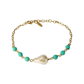 Bracelet en argent doré composé d&#39;une perle de 9x12mm et 6 perles facettées bleues de 4mm de large. Chaîne de 2mm de l...