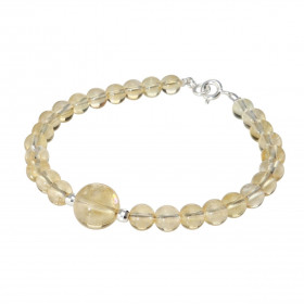 Bracelet Citrine 6-10mm et Argent. Ce bracelet est composé de pierres de 6mm et d'une pierre de 10mm en son centre. Elle e...