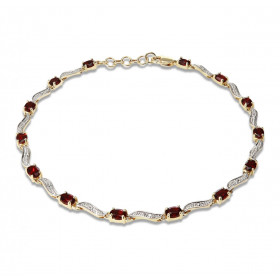 Bracelet Or Jaune 375 2 tons Grenats Ce bracelet est serti 14 grenats ovales 4x3mm espacés par des motifs ondulés Longueur...