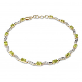 Bracelet Or Jaune 375 2 tons Péridots Ce bracelet est serti 14 péridots ovales 4x3mm espacés par des motifs ondulés Longue...
