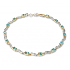 Bracelet Or Jaune 375 2 tons Topazes bleues Ce bracelet est serti 14 topazes ovales 4x3mm espacées par des motifs ondulés ...
