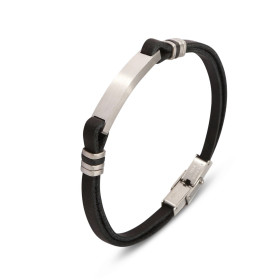 Un bracelet élégant cuir noir une plaque centrale acier inoxydable des détails argentés, fermé par une boucle déployante.