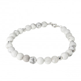 Bracelet Howlite 6mm Argent Ce bracelet est composé pierres 6mm, 4 perles facettées Argent 4mm diamètre d une perle argent...