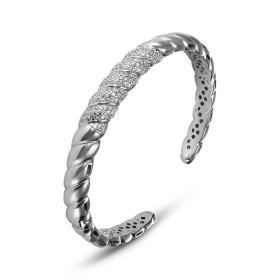 Bracelet jonc en argent rhodié 925 avec effet torsade et oxydes de zirconium. Section de 8,4mm de large. Jonc ouvert s'ada...