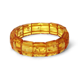 Bracelet Plaquettes Ambre couleur miel 17mm x 18cm Ambre couleur miel Enfilage sur élastique double Largeur : 17mm Longueu...