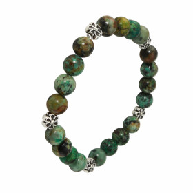 Bracelet Turquoise 8mm et Motif Fleur. Ce Bracelet est composé de 20 perles de 8mm en Turquoise Africaine et de 5 intercal...